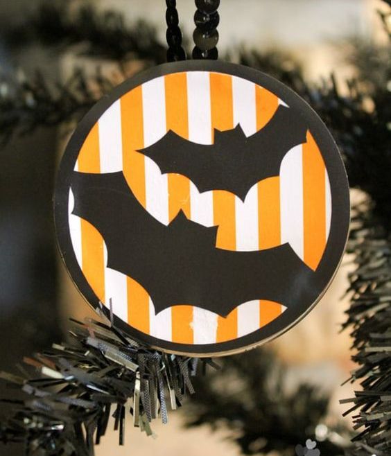 a round Halloween ornament in orange, black and white, with bats and beads is a lovely idea for a Halloween tree
