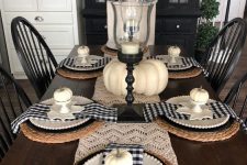 a vintage Thanksgiving tablescape with a macrame runner, buffalo check napkins, woven placemats and black candleholders