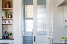 a white frosted glass pocket door like this one won’t take any space and will delicately separate rooms in your home