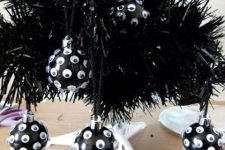 black googly eye Halloween ornaments are amazing for Halloween, and you can DIY them easily and last minute