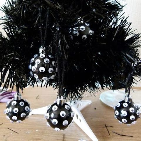 black googly eye Halloween ornaments are amazing for Halloween, and you can DIY them easily and last minute