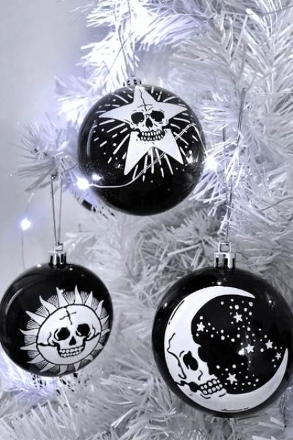 elegant and catchy Halloween ornaments in black and white, with painted images are amazing for styling your space for this holiday