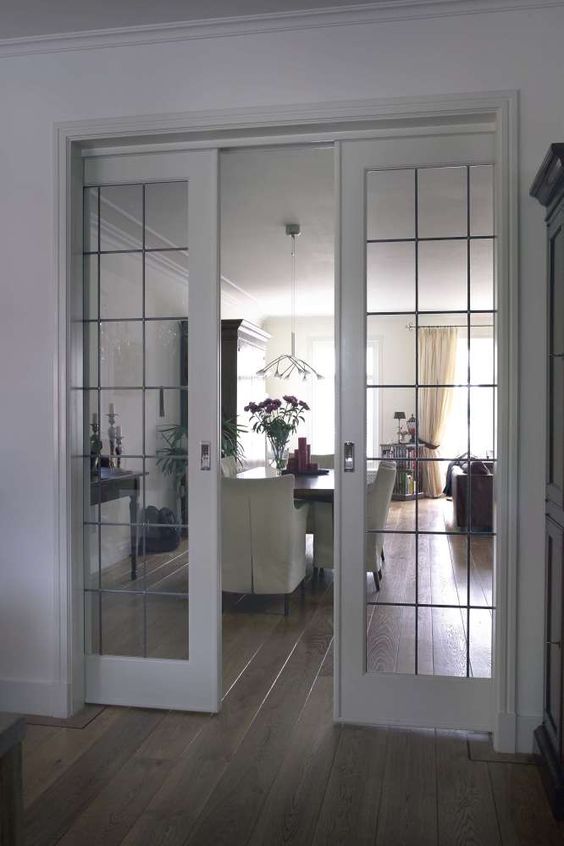 such delicate French glass pocket doors let light in and out when they are closed, that's a great advantage to visually expand the spaces