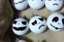 take usual white Christmas ornaments and turn them into spooky Halloween ones, and black and white are traditional colors
