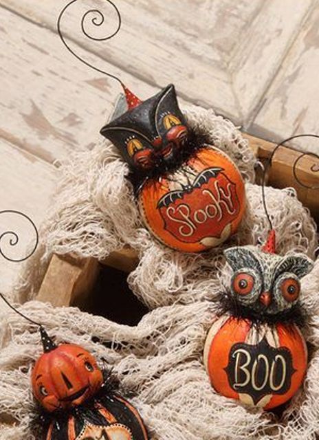 vintage-inspired Halloween ornaments shaped as jac-o-lanterns, owls and cats look scary and bold