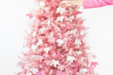 02 a blush Christmas tree decorated with pink and white circus animal cookie ornaments is a creative solution with color and unique ornaments