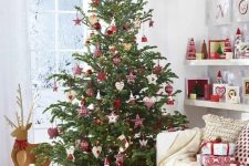 04 a traditional Scandinavian Christmas tree with various red and white ornaments and plaid decorations plus gifts wrapped with red and white printed paper