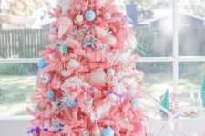 06 a bright candy-colored Christmas tree with bold blue ornaments, ice cream and popsicle ornaments and a candy topper