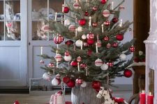 07 a traditional Nordic Christmas tree with white, red and silver ornaments and candy canes as decorations