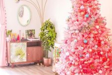 09 a bright pink Christmas tree with pastel and metallic ornaments and a large gold star topper for infusing your space with color