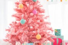 11 a cool candy pink Christmas tree decorated with a bit of pastelc-olored ornaments looks gorgeous, modern, fresh and very pretty