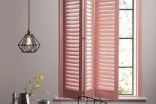 11 a pink shutter screen is a creative idea to add some color to the space and it echoes with the gemetric floor