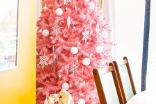 12 a delicate pink Christmas tree decorated with white ornaments of various looks is a tasteful and very girlish choice