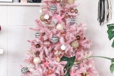 14 a glam pink Christmas tree with white, gold, gold glitter and striped ornaments plus a star on top is a very pretty and stylish idea