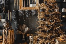 14 jaw-dropping holiday black and gold decor with a faux mantel, a gilded frame and candles, a gold Christmas tree with black ornaments and lots of lights