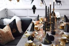 16 a gorgeous silver, gold and black Christmas tablescape with gold chargers, cutlery, mugs, candleholders and black candles plus an oversized black paper star