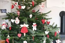 17 a fantastic traditional Scandinavian Christmas tree with red and white felt ornaments of various shapes and a simple burlap tree skirt