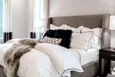 18 a faux fur oversized rug and layered bedding with a faux fur cover are amazing for a modern bedroom