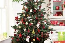 19 a gorgeous traditional Scandi Christmas tree with red and white ornaments of felt and clay in a basket is a fantastic idea