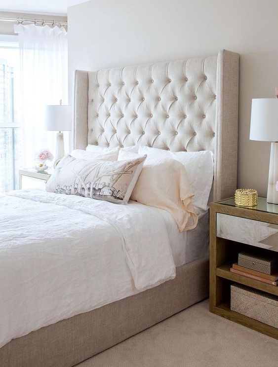 a neutral upholstered wingback headboard is a lovely idea to cozy up your bedroom for winter or any other seasons