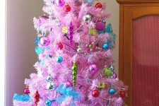 20 a pink Christmas tree with all colorful vintage ornaments, beads, icicles and a bold green star on top is a fun and playful decoration