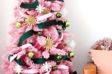 21 a pink Christmas tree with emerald and neutral ribbons and ornaments in various shades of green plus gold touches