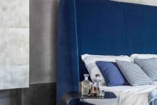 22 a modern electric blue upholstered bed that features a matching statement wingback headboard is a fantastic solution for a modern bedroom