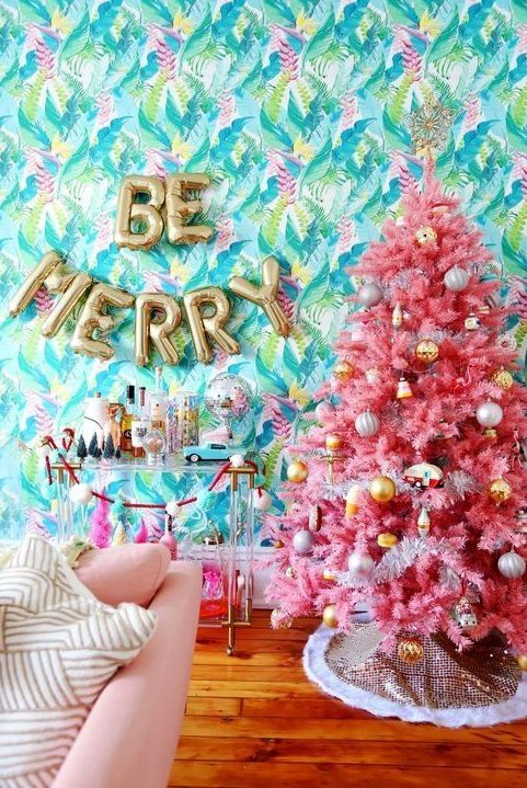 a pink tree decorated with metallic ornaments is a cheerful and bright decor idea to go for at Christmas