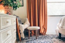 24 lovely heavy rust-colored curtains bring a touch of bold color and interest to the space and make the bedroom wow