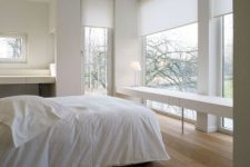 a stylish neutral bedroom design with large windows