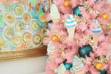 25 a tabletop pink Christmas tree with ice cream ornaments, marigold and teal ones of various sizes is a playful and fun idea