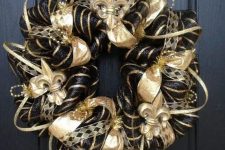26 a glam vintage Christmas wreath in black and gold, with ribbons and beads is amazingly lovely