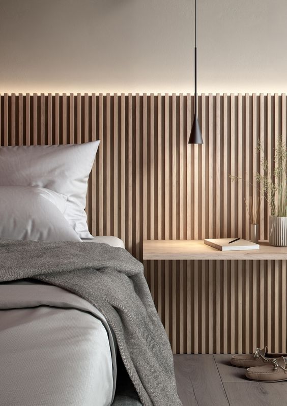 a small pendant lamp paired with light built into a headboard are great to cozy up your bedroom
