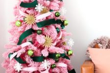 27 an elegant pink Christmas tree with green and gold ornaments, a pink and green velvet ribbon is a chic and bold solution with impeccable taste