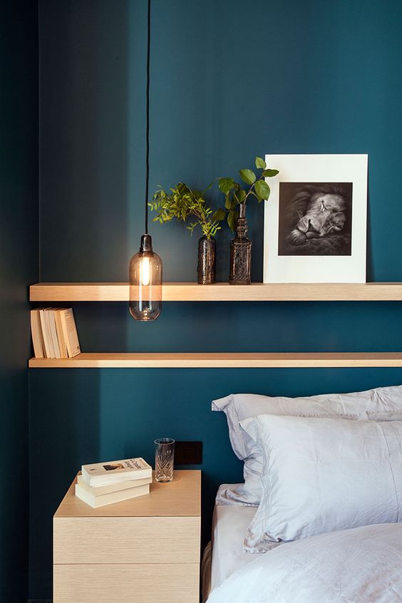 a delicate smoked glass pendant lamp will be a nice alternative to a usual nightstand in your bedroom