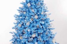 30 an icy blue Christmas tree with white and silver ornaments plus lights is a unique solution that will give a snowy feel to your room