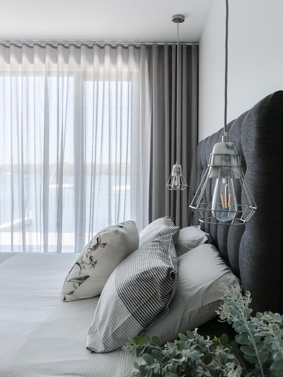 semi sheer grey curtains paired with thicker grey ones for delicate window treating and matching the color scheme