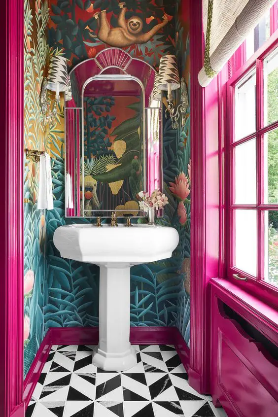 a breathtaking mudroom with bold wallpaper, hot pink walls and a window, a refined mirror and black and white geo tiles on the floor
