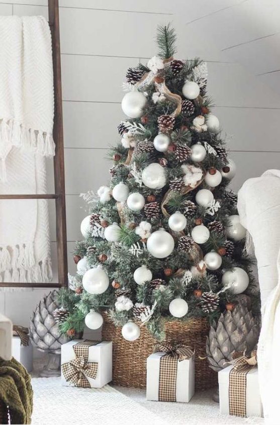 a cozy farmhouse Christmas tree with burlap mesh ribbons, snowy pinecones, pearly ornaments and cotton plus a basket