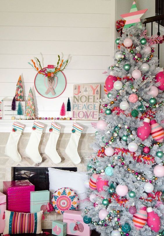 a glam white Christmas tree decorated with white, silver, blush, mint, green ornaments and bulb-shaped oversized pink ones is gorgeous