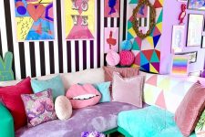 a jaw-dropping maximalist living room with mismatching walls, a sectional that includes various upholstery and pillows, a colorful chandelier and accessories