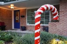a large PVC candy cane will style your outdoor space for Christmas and it’s easy to make yourself