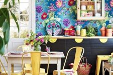 a cute kitchen with a floral wallpaper