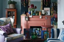 a maximalist living room with green walls, a lilac chair and a blue and white sofa, colorful pillows, a coral fireplace and bright accessories