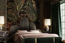 a moody maximalist bedroom with alcove ceilings, a bed with a statement headboard, a dark green bench and curtains plus a dark accent wall