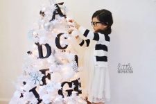 a small white Christmas tree decorated with black letters will help your kids learn them – make such a space for your kids’ room