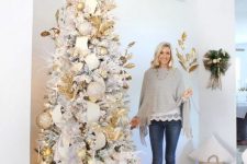 a southern glam Christmas tree with usual and oversized metallic and glitter Christmas ornaments and lights plus gilded leaves