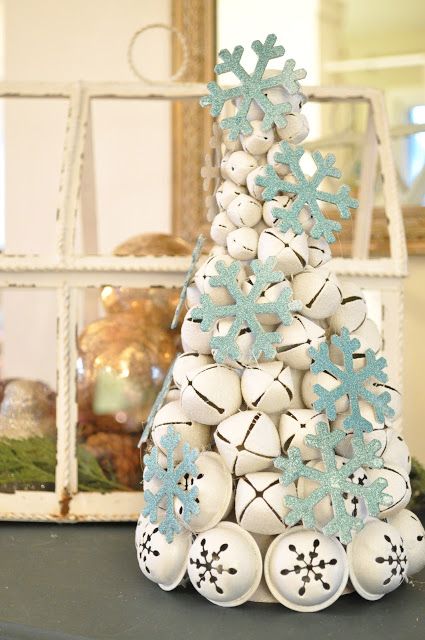 a white Christmas bell tree decorated with light blue glitter snowflakes is a creative alternative to a usual Christmas tree