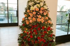 an exquisite Christmas tree with ombre floral decor – white, pink, red and burgundy blooms and lights is a bright idea