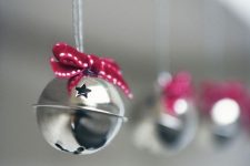 beautiful silver bells with red bows are great for decorating trees, mantels, windows and other pieces and look very festive-like